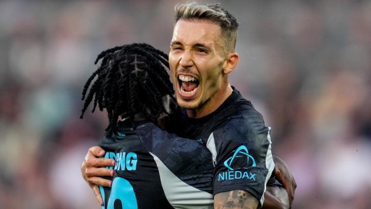 Leverkusen wing-back Alex Grimaldo celebrates